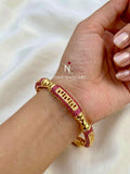 GOLDEN TONE RUBY BANGLE
